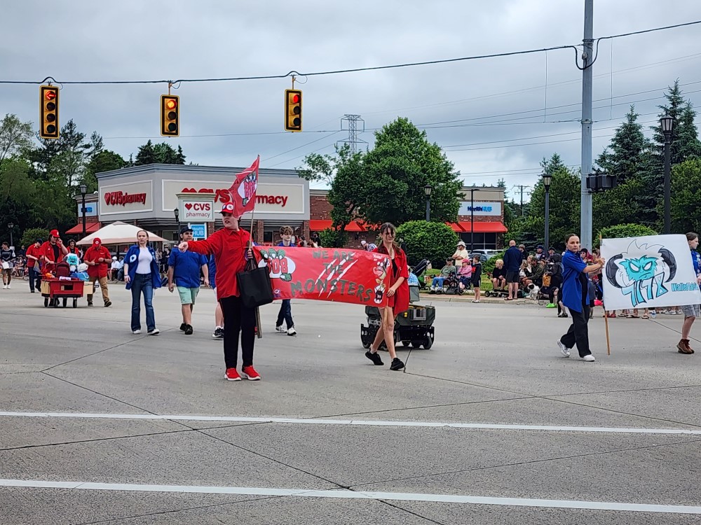 308 and 7178 holding banners in the parade.