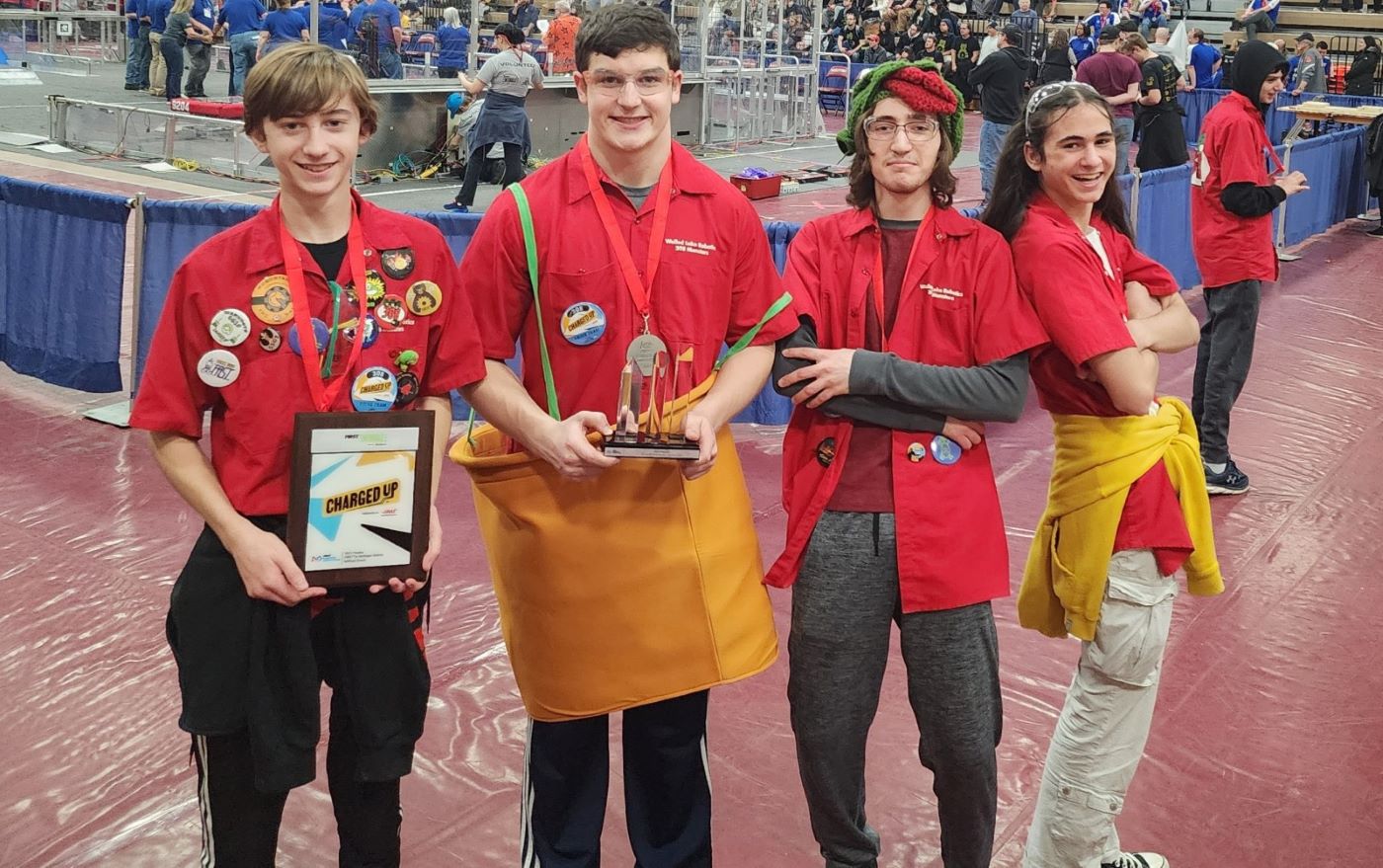 FRC drive team holding a finalist award.